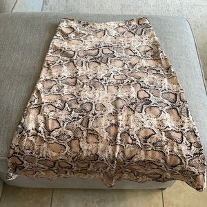 Silky midi snake print skirt.